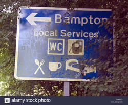 road-sign-to-bampton-local-services-wc-petrol-food-drink-beds-brampton-AAKEE1.jpg