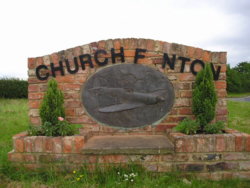 North Yorkshire Scenes. Church Fenton. Village Sign.1.JPG