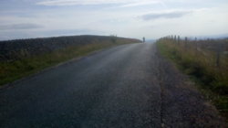Caution on the newly tarmaced chippings road.jpg