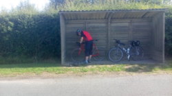 Colin fixing his loose GPS device mount in the shade.jpg