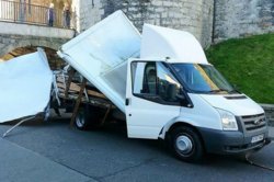 white-van-wedged-under-an-historic-Caernarfon-bridge-arch.jpg