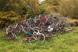 47694996-pile-of-rusty-bent-and-wrecked-old-bikes.jpg