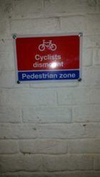 Cyclists dismount pedestrian zone.jpg