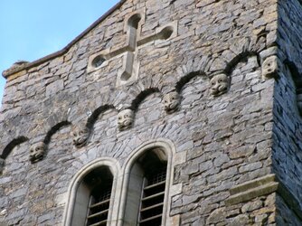 231030-3465 Northwick St Thomas-tower top from SE-corbel heads.JPG
