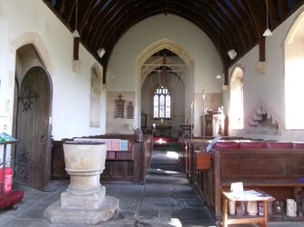 250331-0601  Littleton Drew All Saints nave-chancel font from W.JPG