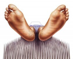 1363229444_11779863-bed-of-nails-with-fakir-viewed-from-feet.jpg
