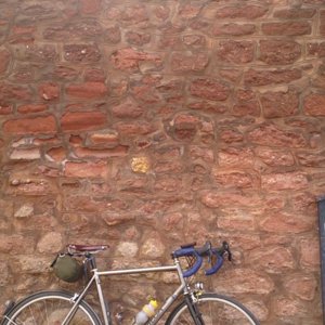 Bike in front of a wall.